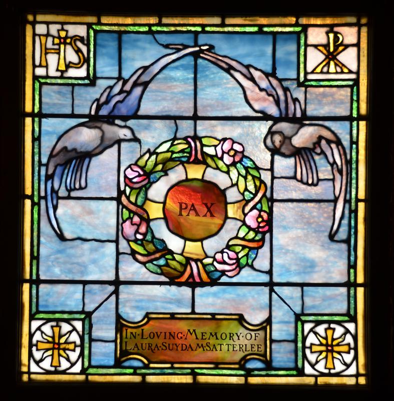 Satterlee Memorial Window:  two doves hovering above a flowering wreath with a Byzantine cross