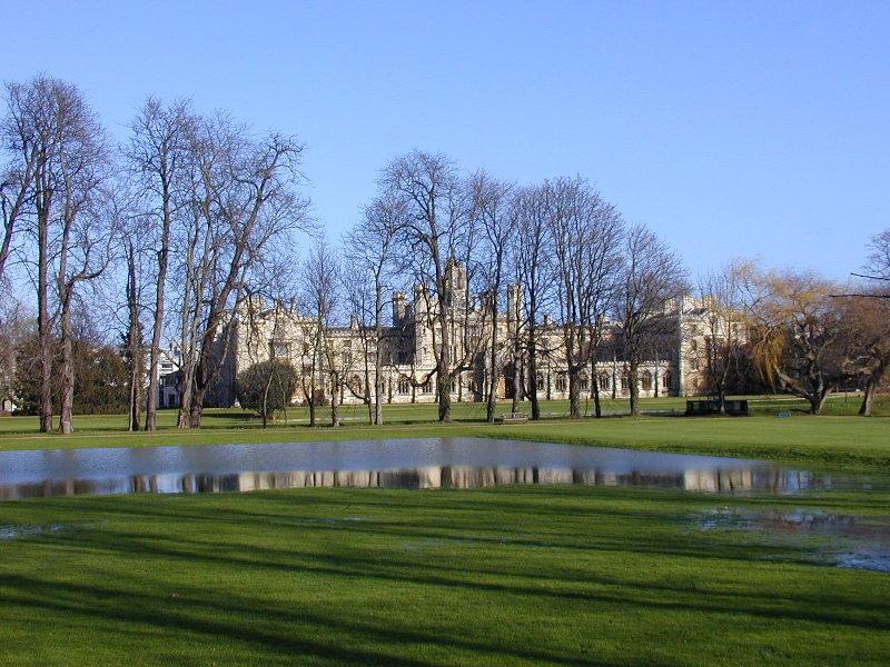 Trinity College Backs with St John's College New Court, a small lake, Cambridge, England