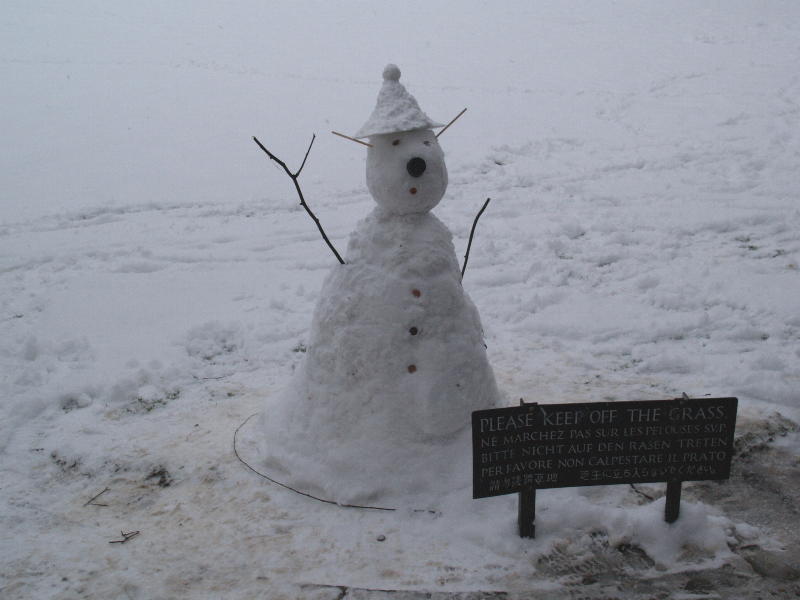 Snow man with hat, King's College, Cambridge, England