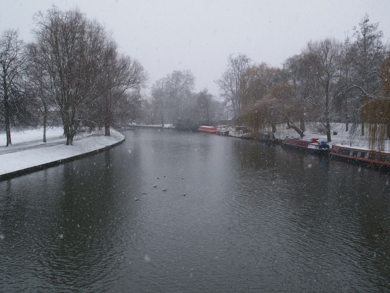 snowy view of Cam west from Jesus Lock bridge, Cambridge, England