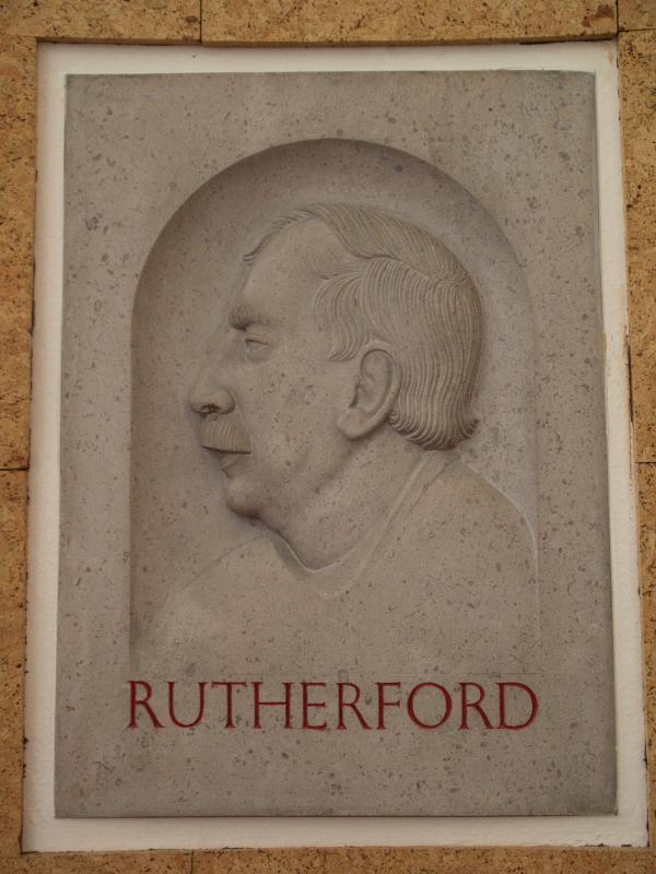 Cambridge, England: New Museum Site (old Cavendish laboratory): relief of Ernest Rutherford (1933-1935, sculptor Eric Gill)