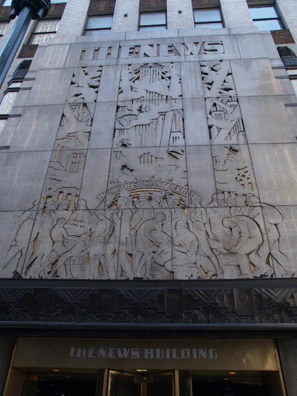 New York City, NY: 220 East 42nd Street (former Daily News Building): wall decoration over entrance (building 1928-1930, John Mead Howells, Raymond Hood and J. Andre Fouilhoux)