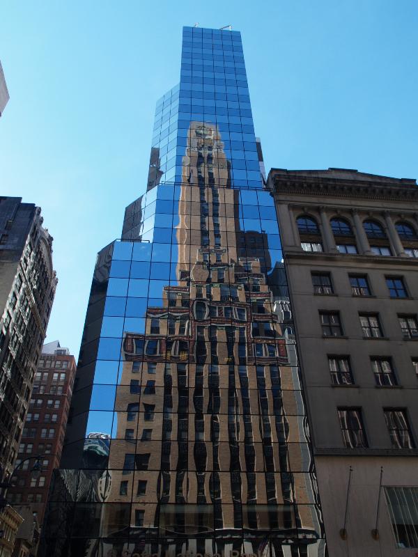 New York City, NY: 551 Fifth Avenue (Fred R. French Building): facade (1926-1927, Sloan and Robertson, and H. Douglas Ives) reflected in Safra National Bank (2006, Cetra/Ruddy)
