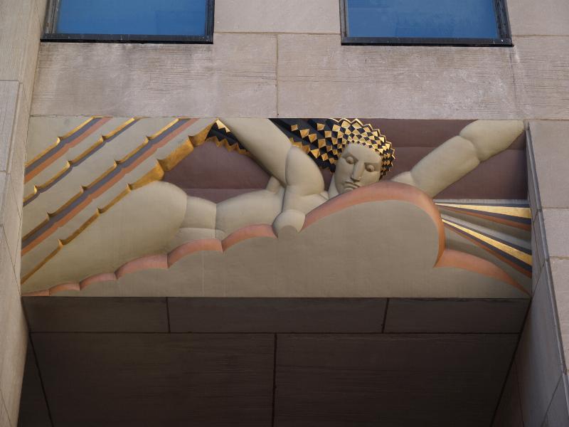 New York City, NY: 30 Rockefeller Plaza (GE Building, formerly RCA Building, Rockefeller Center): 'Light' (decoration above right door) (art deco, 1932, Lee Lawrie, colorist Leon V. Solon)