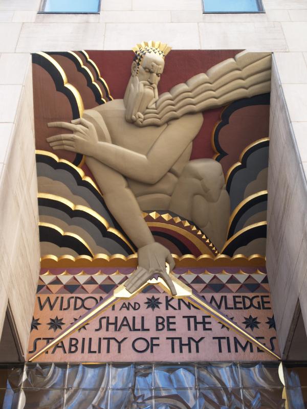 New York City, NY: 30 Rockefeller Plaza (GE Building, formerly RCA Building, Rockefeller Center): 'Wisdom' (decoration above center door) (art deco, 1932, Lee Lawrie, colorist Leon V. Solon)