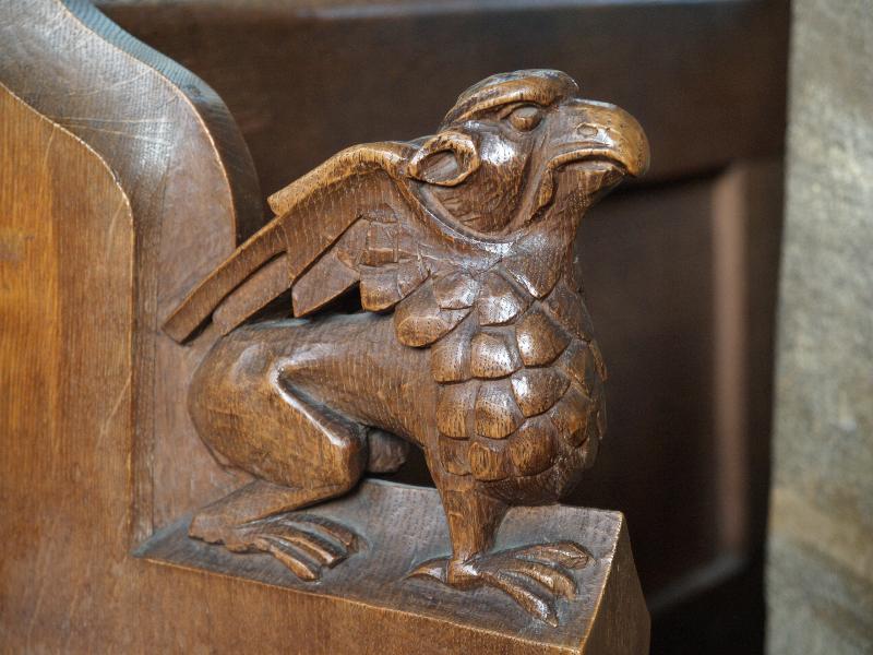 Cambridge, England: St Andrew's Church, Chesterton: oak bench carving of griffin