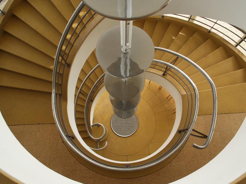 Bexhill-on-Sea, England: De La Warr Pavilion: spiral staircase and chandelier from above (1935, Erich Mendelsohn and Serge Chermayeff; restored 2005, John McAslan and Partners)