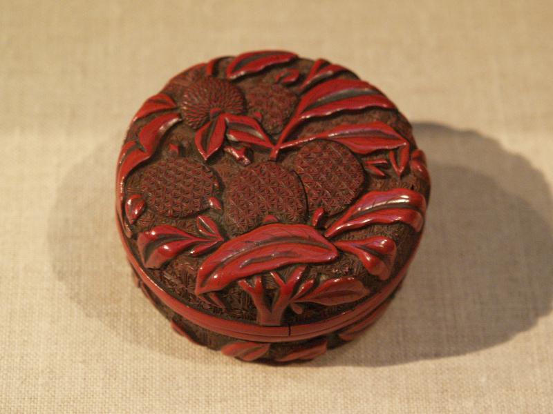 New York City, NY: Metropolitan Museum of Art: lacquer circular incense box with design of lichees (China, late 16th-early 17th century)
