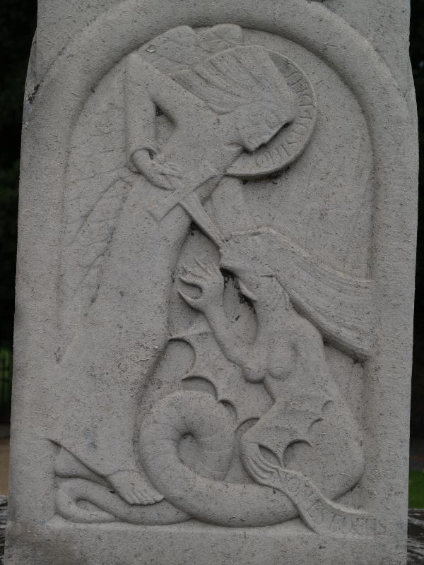 Trumpington, England: War Memorial: relief of St Michael (1921-1922, Eric Gill)