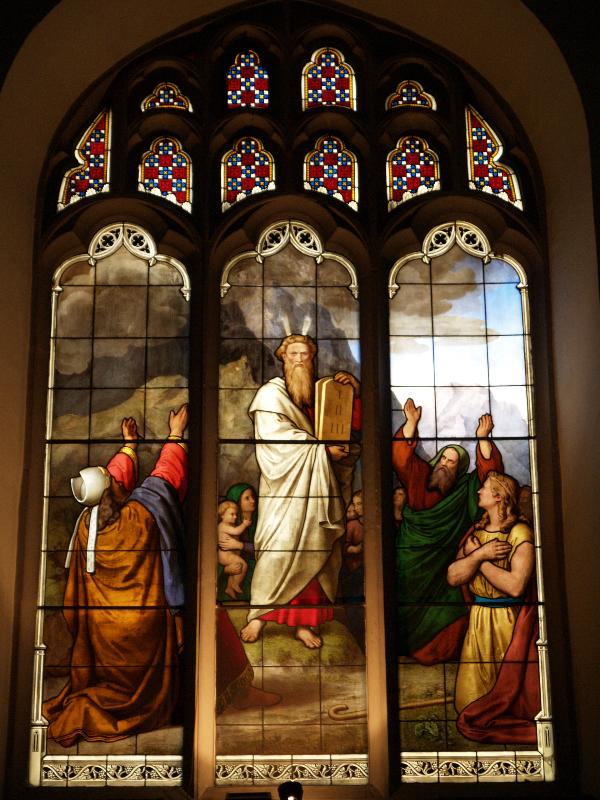 Cambridge, England: Peterhouse: chapel stained glass window, Moses and Ten Commandments (1850s, overall design by Max Emanuel Ainmiller, figures largely work of Claudius Schraudolph and Heinrich von Hess, Royal School of Glass Painting, Munich)