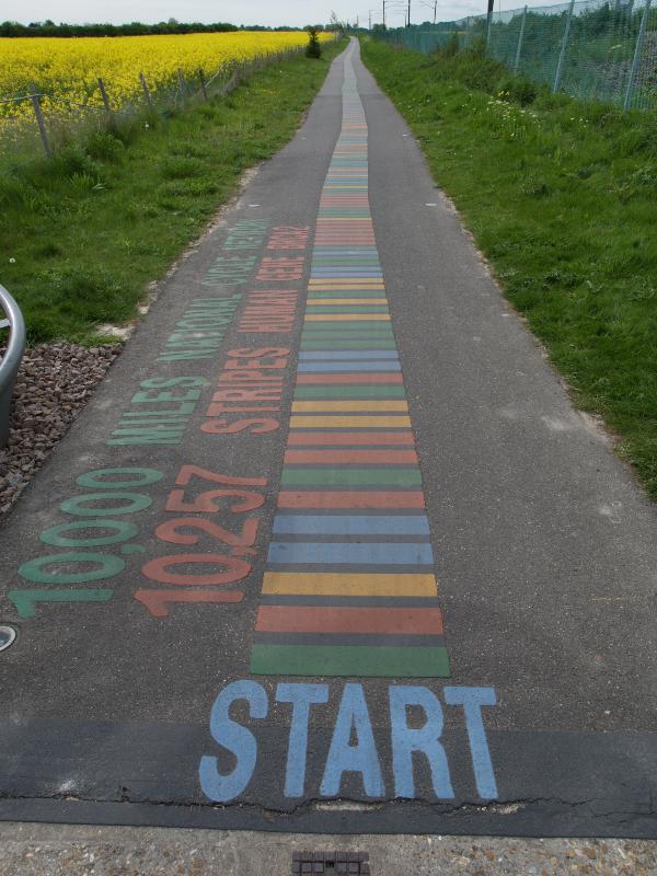 Cambridge, England: National Cycle Network, Route 11 (Cambridge to Great Shelford): Genome Stripes (BRCA2 gene painted on pavement) (2006, artist Katy Hallett)