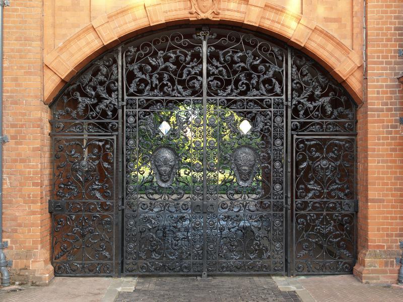 Cambridge, England: Newnham College: Pfeiffer Archway gate (1893, designer Basil Champneys, maker Thomas Elsley)