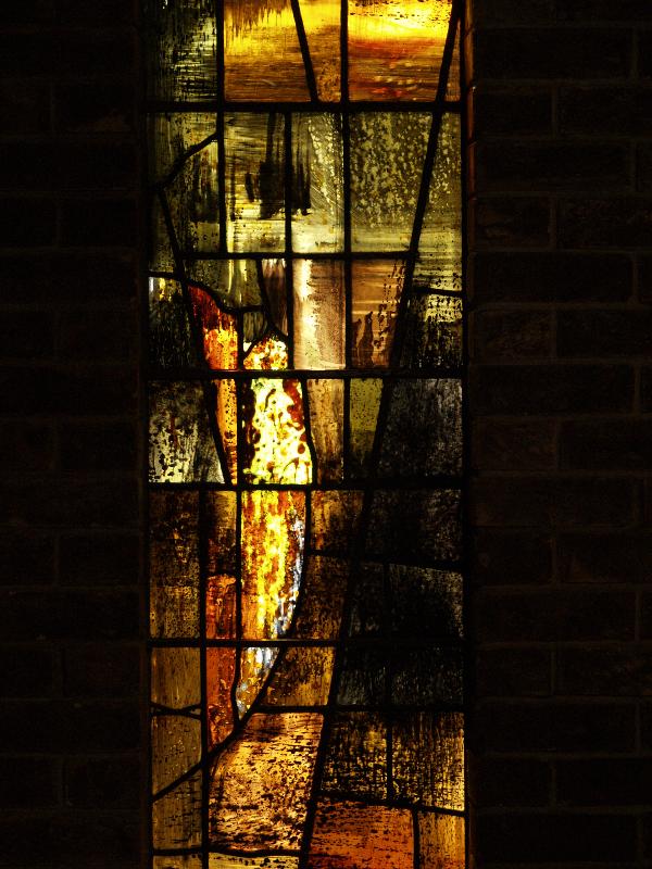 Cambridge, England: Churchill College: chapel, brown-yellow stained glass, detail (1967, artist John Piper)