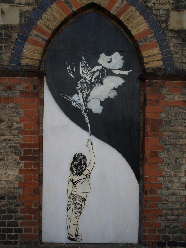 Cambridge, England: St Philip's Church: graffiti on old entrance (2008, artist Maya)