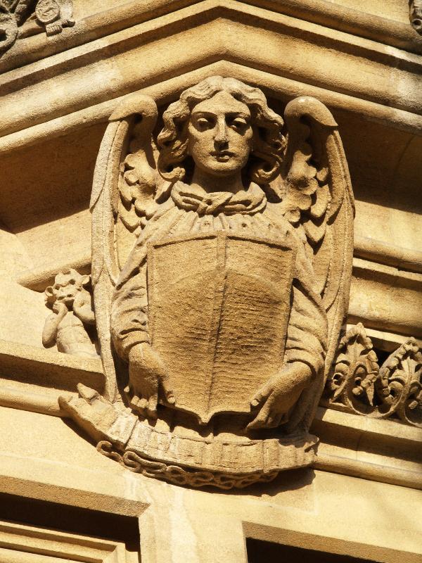 Cambridge, England: Sidney Street: angel carving (1935, architect Munro Cautley and Barefoot)