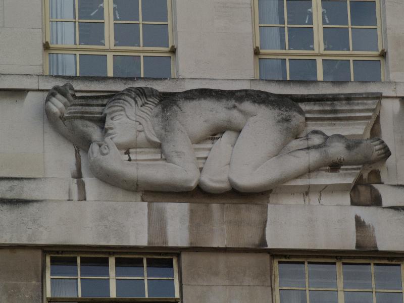 London, England: Broadway, Transport for London (originally London Underground): North Wind (1928-1929, sculptor Eric Gill, architect Charles Holden)