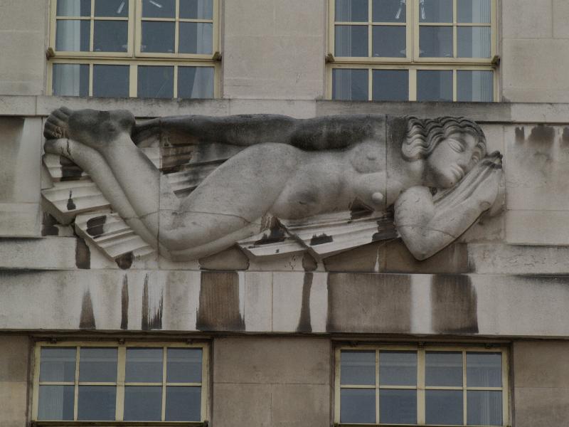 London, England: Broadway, Transport for London (originally London Underground): South Wind (1928-1929, sculptor Eric Gill, architect Charles Holden)