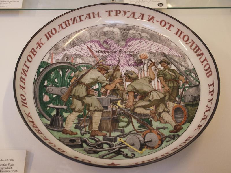London, England: British Museum: porcelain dish, military heroic deeds (1920, designed and painted at the State Porcelain Factory, Petrograd, by Vasilii Timorev)