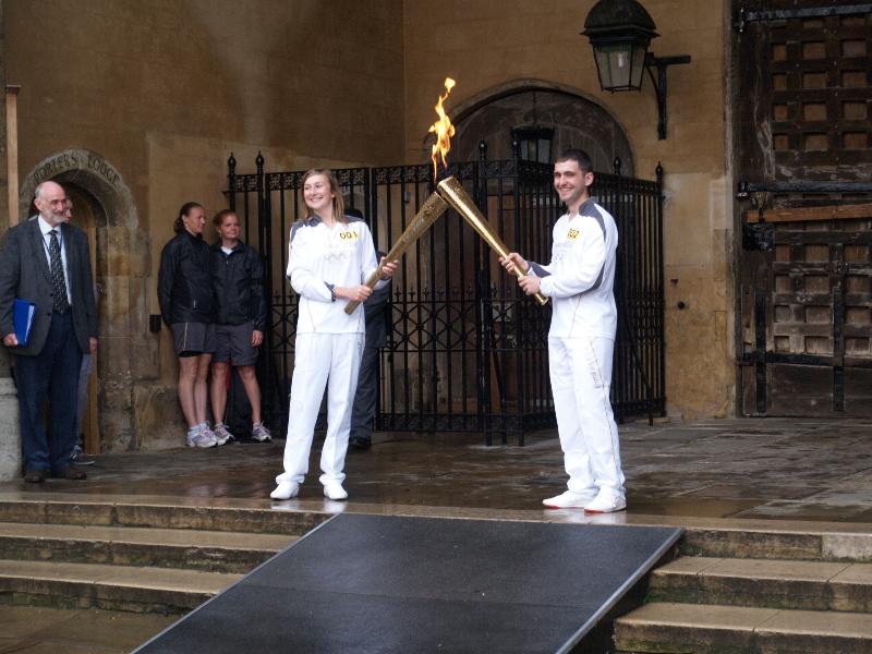Cambridge, England: Trinity College: Olympic Torch Relay, Great Court, first and second torch bearers