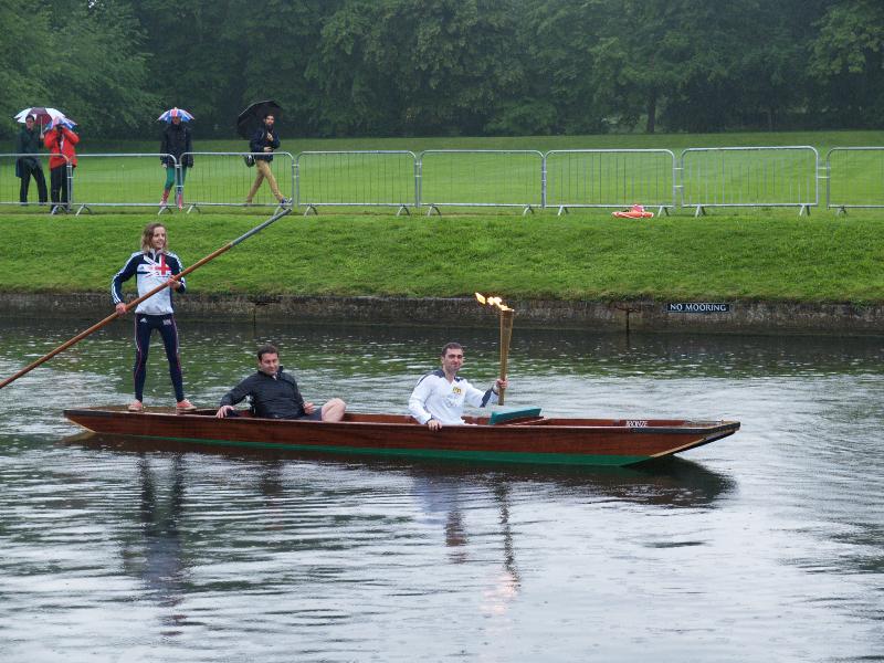 Cambridge, England: Trinity College: Olympic Torch Relay, second torch bearer on punt