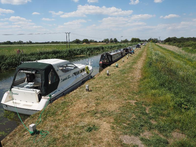 Upware, England: Burwell Lode: river boats along side of canal