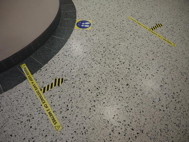 Cambridge, England: Department of Biochemistry: Covid-19 social distancing signage on floor