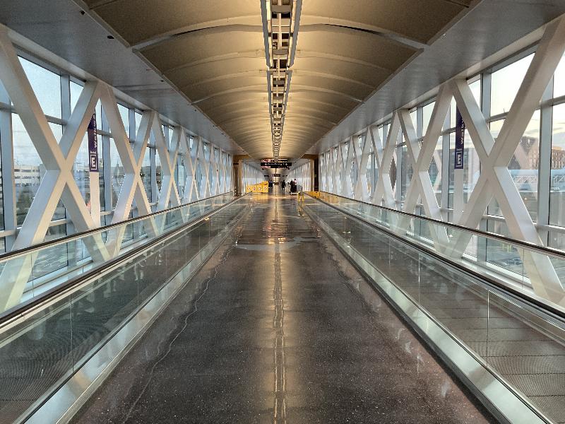 Boston, Massachusetts (MA): Logan Airport, Terminal E: relatively empty walkway (because of Covid-19)