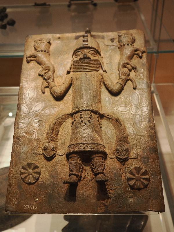 London, England: British Museum: cast brass plaque, figure with two animals (16th century, Benin, Nigeria)