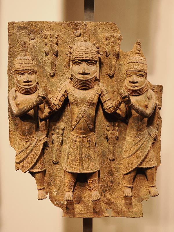 London, England: British Museum: cast brass plaque, three men and four animal heads (16th century, Benin, Nigeria)