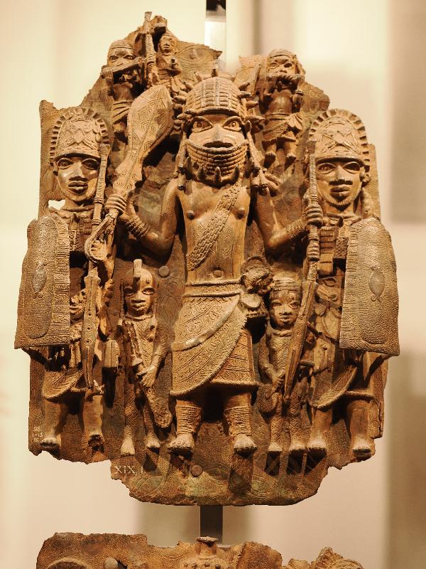 London, England: British Museum: cast brass plaque, three large men and five small men (16th century, Benin, Nigeria)