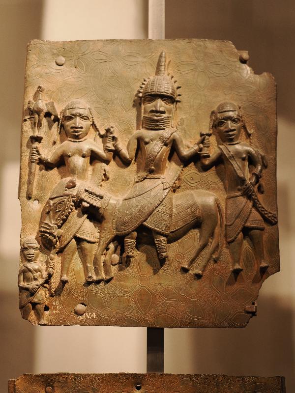 London, England: British Museum: cast brass plaque, three large men, one on horse, and one small man (16th century, Benin, Nigeria)