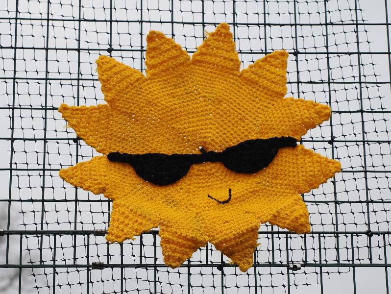 Cambridge, England: Jesus Green: yellow sun with sunglasses