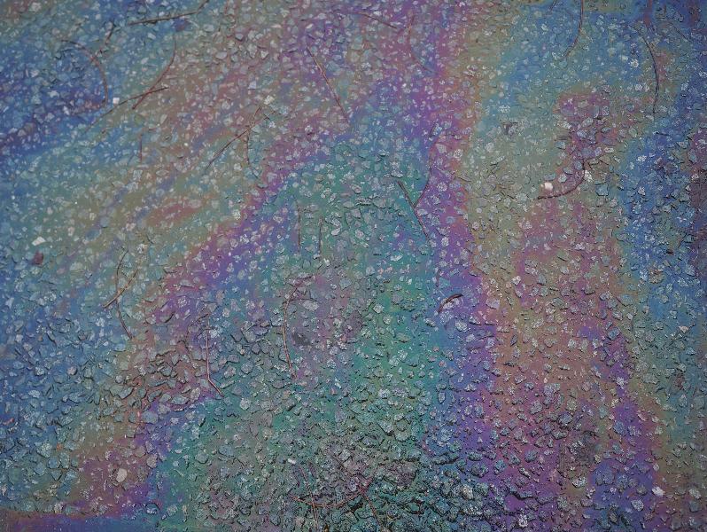 Cambridge, England: Carlyle Road: oily slick on road