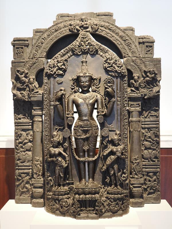 London, England: British Museum: Vishnu and his consorts within an arched temple niche