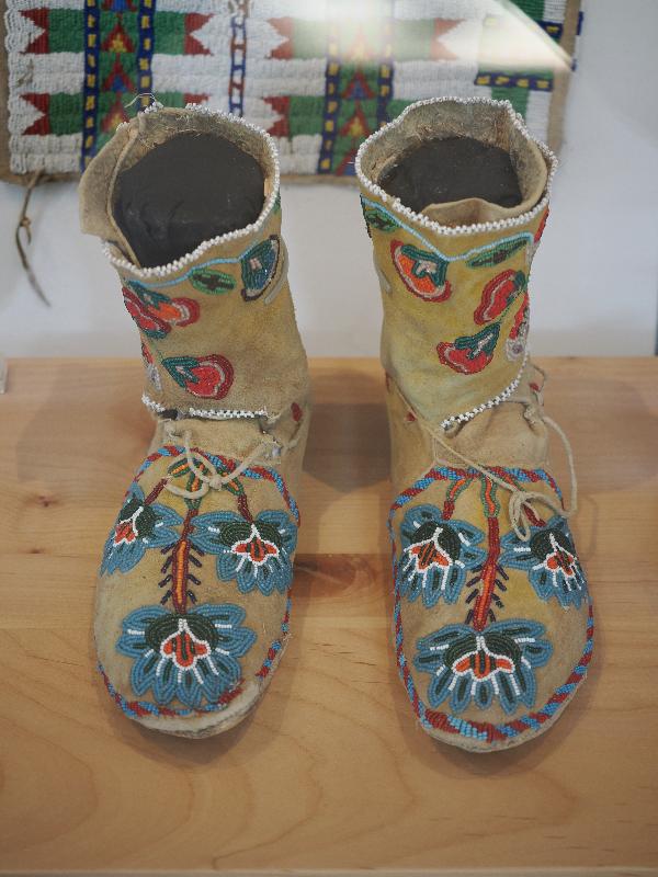 Flagstaff, Arizona (AZ): Museum of Northern Arizona: Mamach, nuupacha (woman's moccasins) (19th century, Colorado) (deerskin, button, brass, and glass beads)