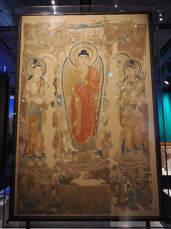 London, England: British Museum: embroidery of the Buddha emerging from a rocky mountain (about AD 700s, Cave 17, Mogao Caves, China)