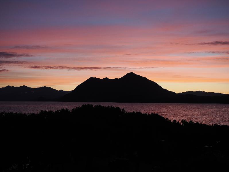 Stresa, Italy: view of mountains (near Cittiglio) on other side of lake at sunrise