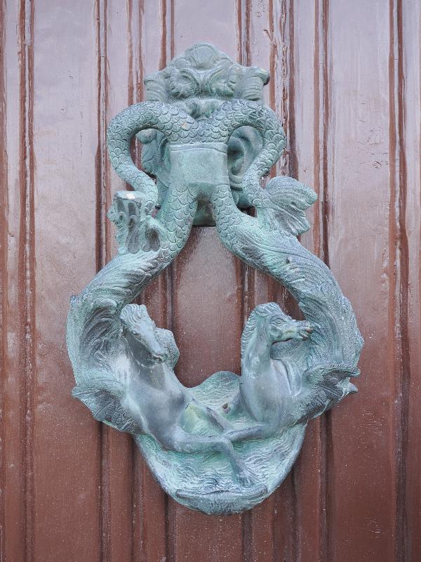 Varenna, Italy: Villa Monastero, garden: door knocker, winged horses (and missing figure)
