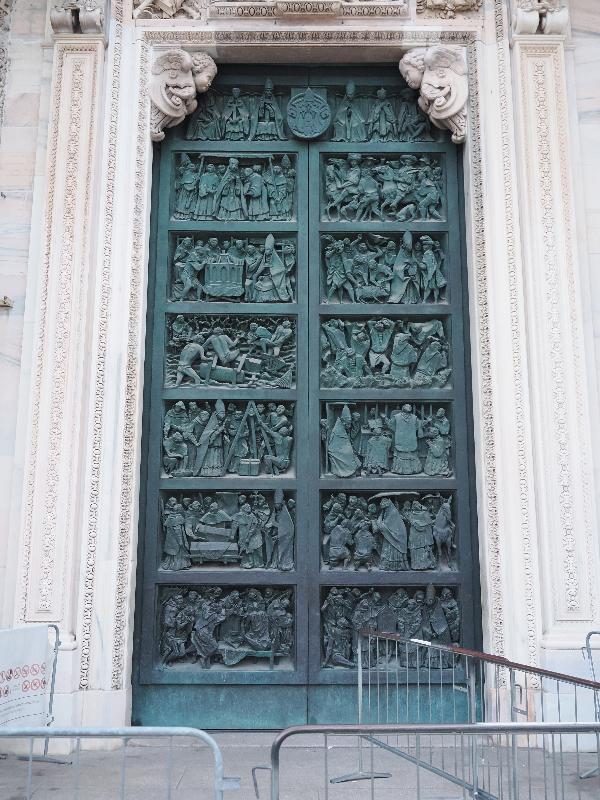 Milan, Italy: Duomo di Milano: far right entrance, The Splendour of the Duomo (1965, Luciano Minguzzi)