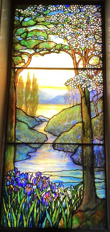 Howes Memorial Window:  landscape with conifer at left and dogwood at right, water and irises