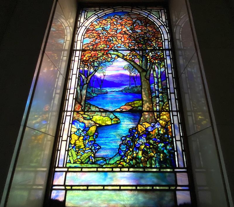 J. Rose Stern Memorial Window:  landscape with trees at left and right, mountains and water