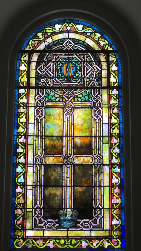 Bergen Memorial Window:  cluster of foliage drawn in a wreath-like form and the tone is of soft gold, with ornaments of delicate green