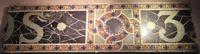 fragments of Tiffany Studios building signage fragments of Tiffany Studios building signage