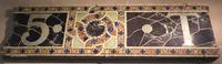 fragments of Tiffany Studios building signage fragments of Tiffany Studios building signage