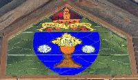 California, Tahoe City, Chapel of the Transfiguration: Porter Commemorative Window:  seal of the Episcopal Diocese of Sacramento consisting of a golden chalice on a shield of blue flanked by two silver shells